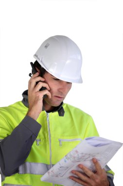 Worker with a two-way radio clipart