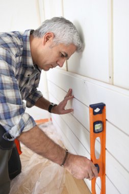 Man using spirit level clipart