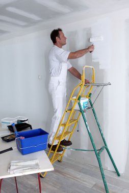 Man painting wall clipart