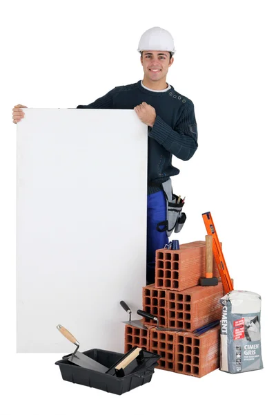 Bricklayer with a blank board — Stock Photo, Image
