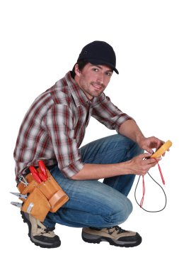 Man taking electrical reading clipart