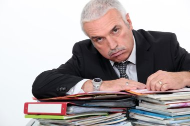 Man leaning on paperwork clipart