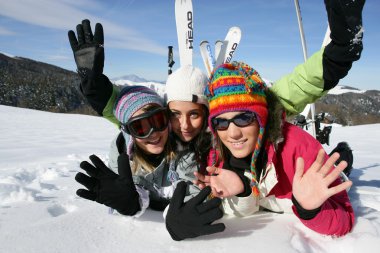 Teenagers on the ski slopes clipart