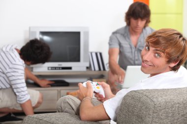 Young men getting ready to play a video game clipart