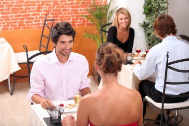 Couples eating in a restaurant clipart