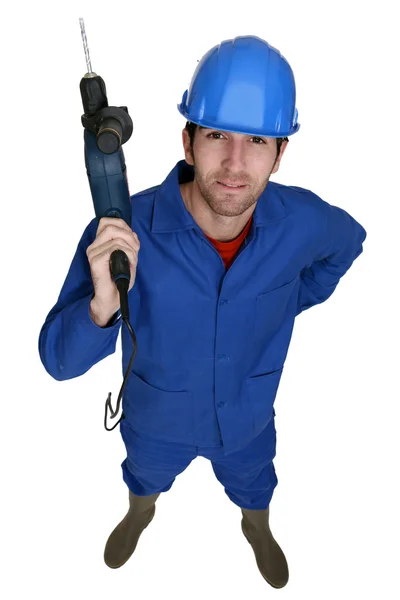 Handwerker hält einen Elektroschrauber hoch — Stockfoto