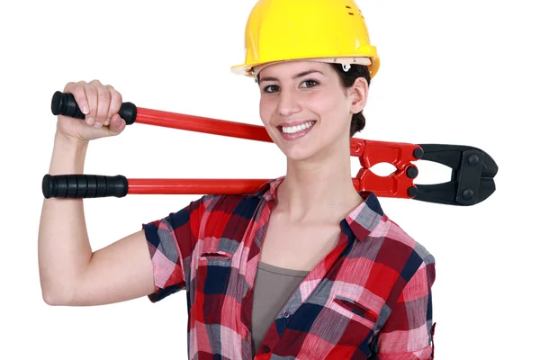 Uma trabalhadora de construção feminina com alicate . — Fotografia de Stock