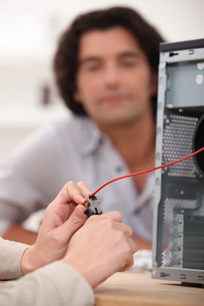 Close-up of hands fixing computer — Stock Photo, Image