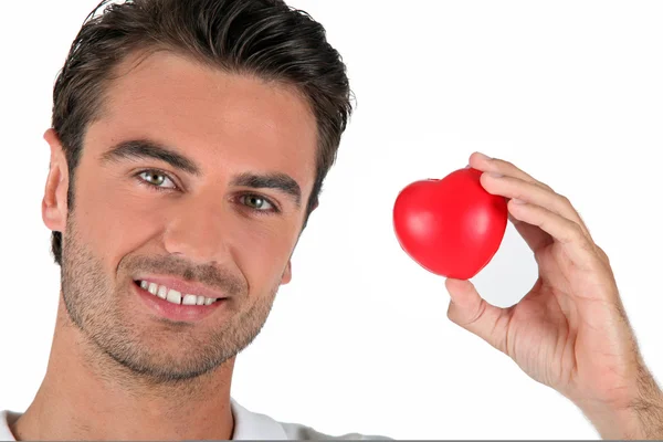 Portrait of a man holding a heart — Stock Photo, Image