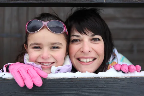 Mother and daughter playing snow — Stock Photo, Image
