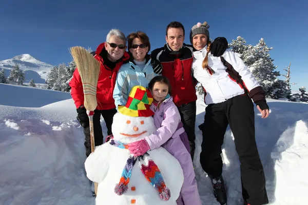 Happy family on a winter vacation — Stock Photo, Image
