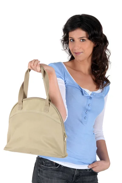 Portrait of a young woman with handbag — Stockfoto