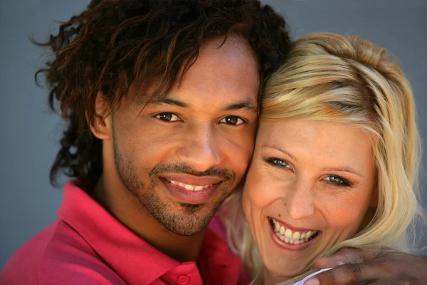 Mixed couple hugging each other — Stock Photo, Image