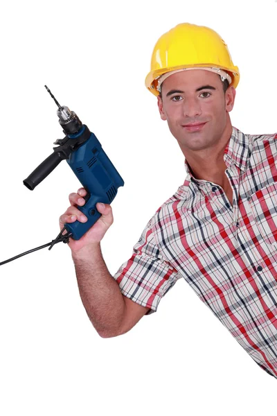 Tradesman holding an electric screwdriver — Stock Photo, Image