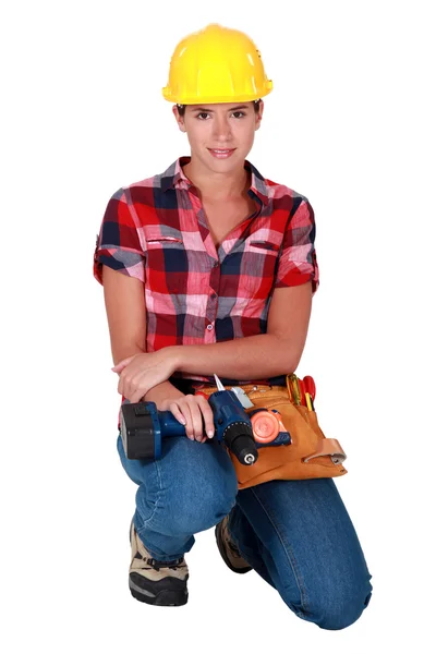 Craftswoman segurando uma broca — Fotografia de Stock