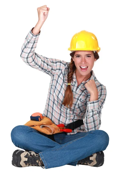 Female builder raising fist — Stock Photo, Image