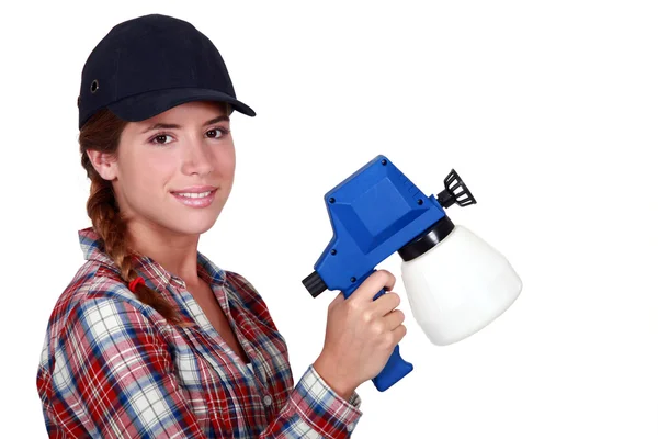 Woman holding spray for painting — Stock Photo, Image