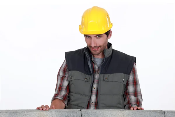 Shy worker behind wall — Stock Photo, Image