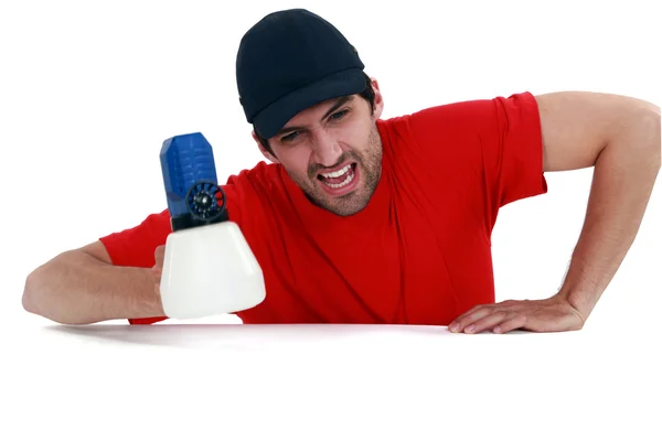 Angry man holding spray paint — Stock Photo, Image