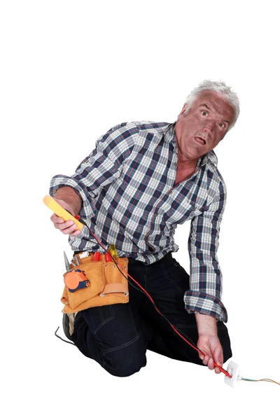 A shocked electrician. — Stock Photo, Image