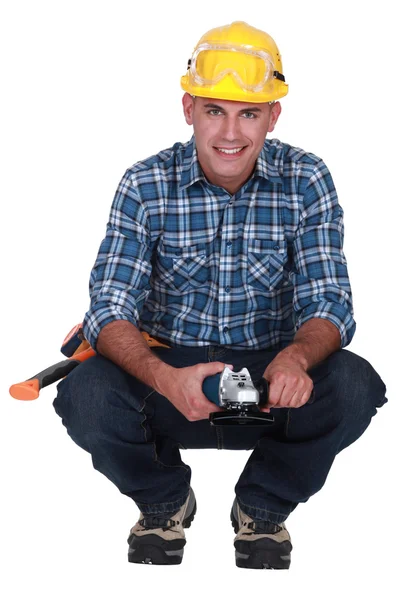 Man holding angle-grinder — Stock Photo, Image