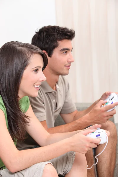 Young couple playing computer games — Stock Photo, Image