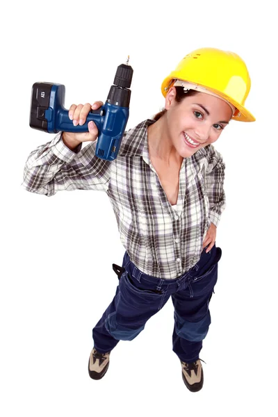 Tradeswoman holding a power tool Stock Image