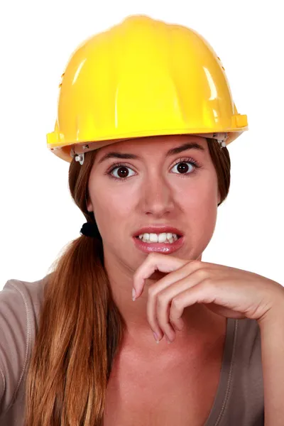Woman wearing helmet looking disgusted Stock Image