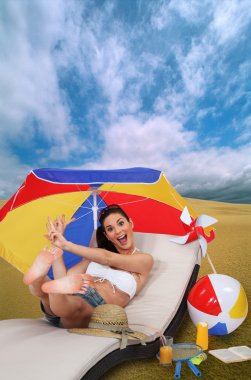 Woman laying on sun lounger clipart