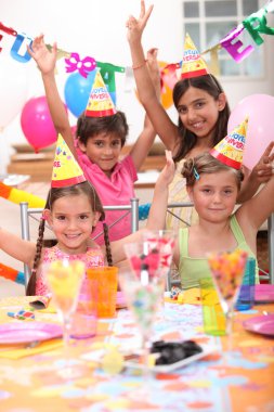 Children at a birthday party clipart