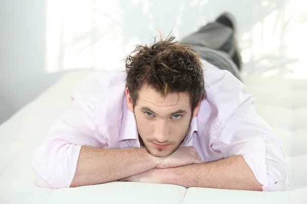 Man laying in bed — Stock Photo, Image