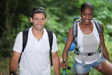 Two hikers in the woods clipart