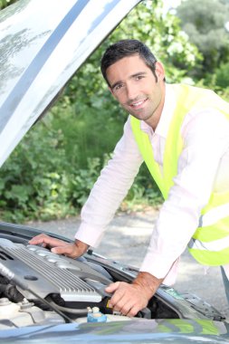 Man looking under car bonnet clipart