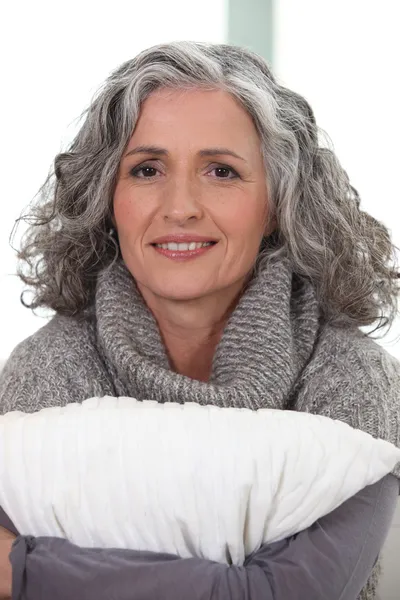 Mature grey-haired woman smiling — Stock Photo, Image