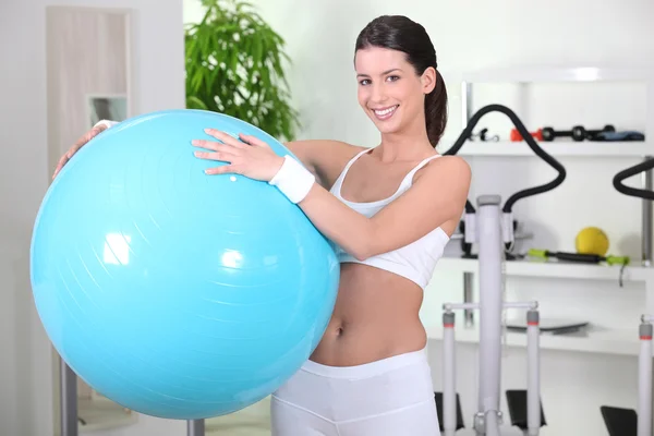 Young woman holding a gym ball — Stock Photo, Image