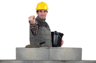 Bricklayer pointing ahead clipart