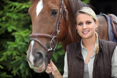 Young woman with a horse clipart