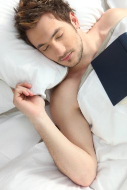 Man who fell asleep reading a book clipart