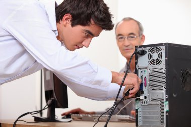 Man fixing a computer clipart