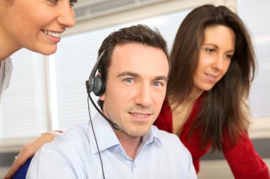 Man training with a telephone headset clipart