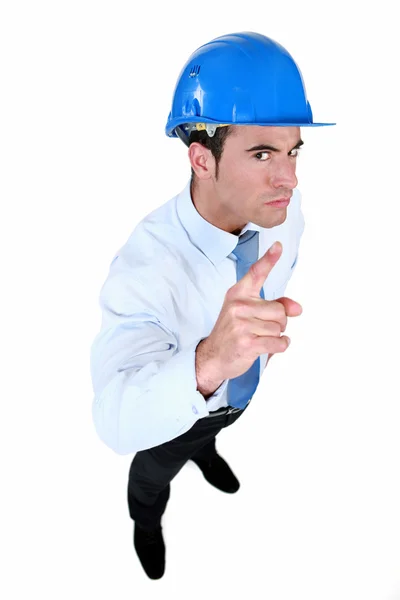 Helmeted foreman with threatening look — Stock Photo, Image