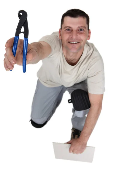 Workman with a pair of pliers — Stock Photo, Image