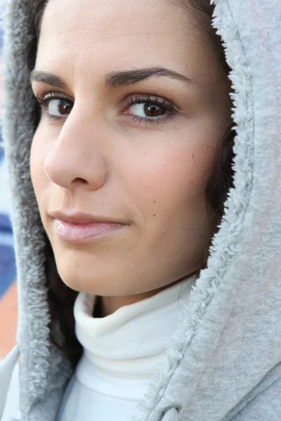 Woman wearing hooded coat — Stock Photo, Image