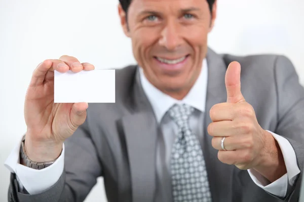 Businessman showing card — Stock Photo, Image