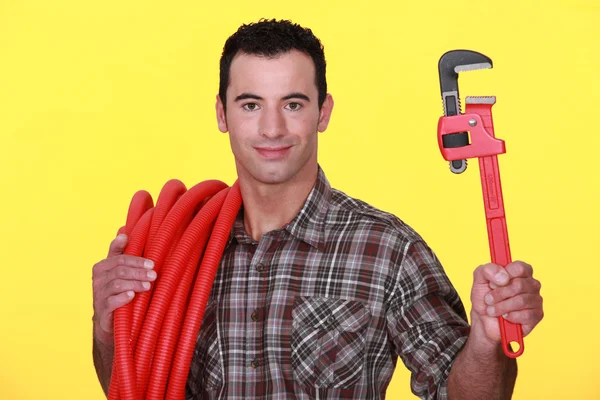 Workman on yellow background — Stock Photo, Image