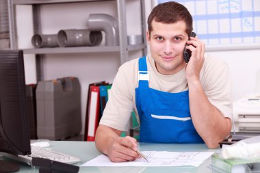 Plumbers merchant on the telephone clipart
