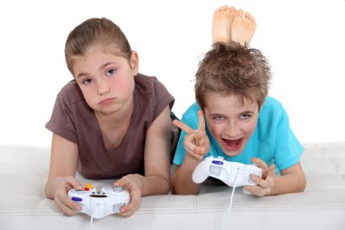 Children playing computer games clipart