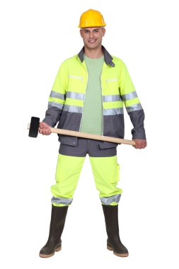 Tradesman holding a mallet clipart