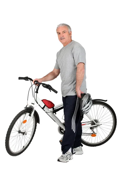Middle-aged man with bike — Stock Photo, Image