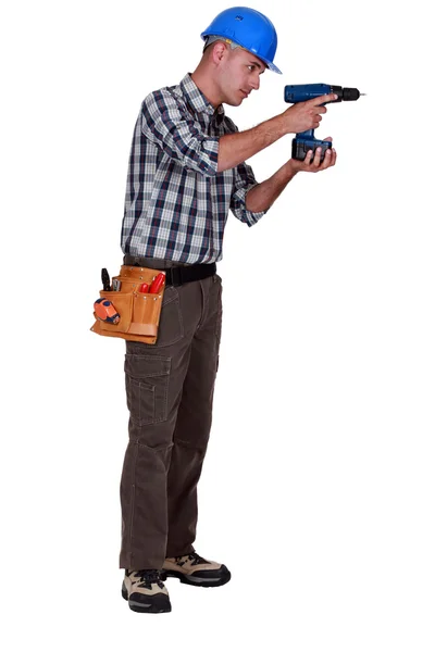 Craftsman working with a cordless drill — Stock Photo, Image